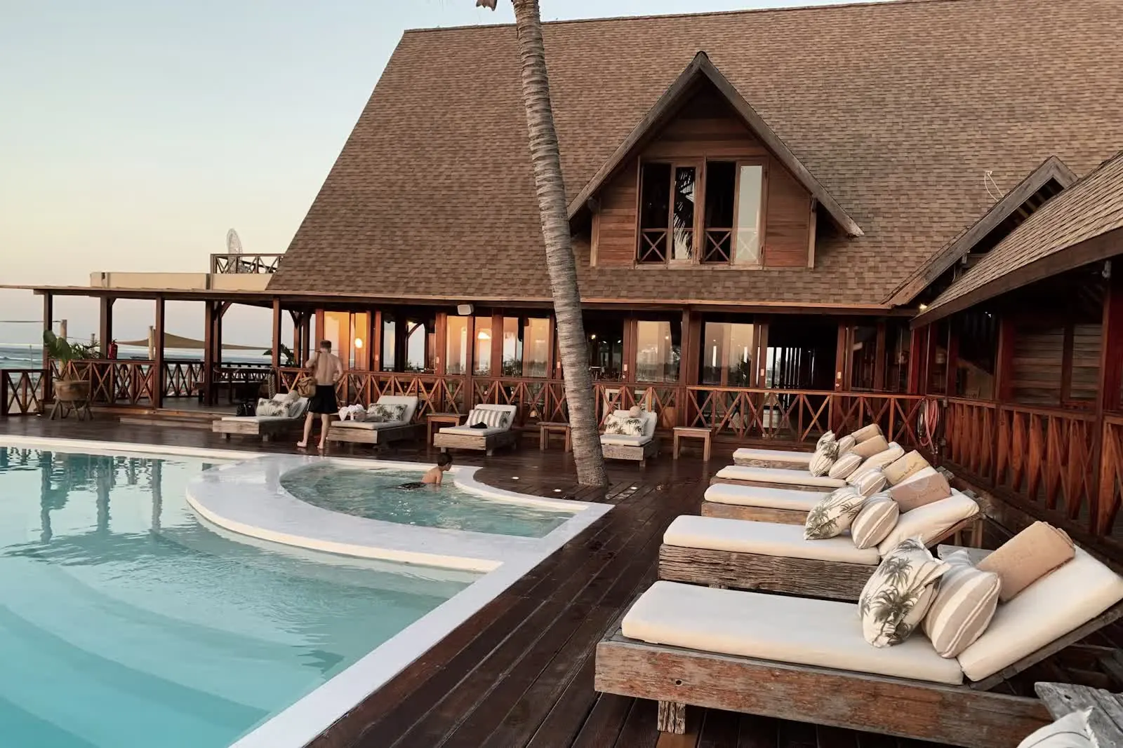 Luxury hotel pool and resort at sunset